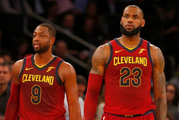 NEW YORK, NY - NOVEMBER 13:  (NEW YORK DAILIES OUT)    LeBron James #23 and Dwyane Wade #9 of the Cleveland Cavaliers look on against the New York Knicks at Madison Square Garden on November 13, 2017 in New York City. The Cavaliers defeated the Knicks 104-101. NOTE TO USER: User expressly acknowledges and agrees that, by downloading and/or using this Photograph, user is consenting to the terms and conditions of the Getty Images License Agreement.  (Photo by Jim McIsaac/Getty Images)