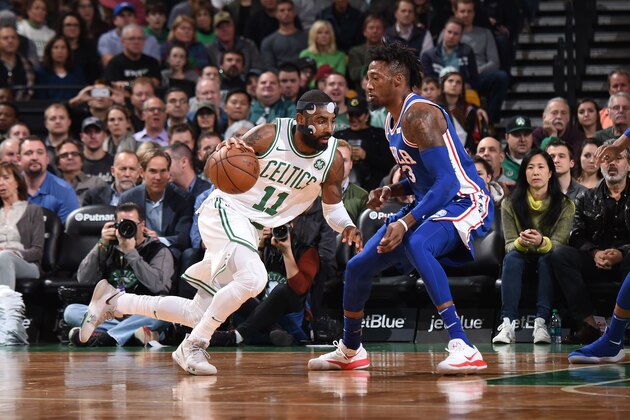 BOSTON, MA - NOVEMBER 30:  Kyrie Irving #11 of the Boston Celtics drives to the basket against Robert Covington #33 of the Philadelphia 76ers on November 30, 2017 at the TD Garden in Boston, Massachusetts.  NOTE TO USER: User expressly acknowledges and agrees that, by downloading and or using this photograph, User is consenting to the terms and conditions of the Getty Images License Agreement. Mandatory Copyright Notice: Copyright 2017 NBAE  (Photo by Brian Babineau/NBAE via Getty Images)