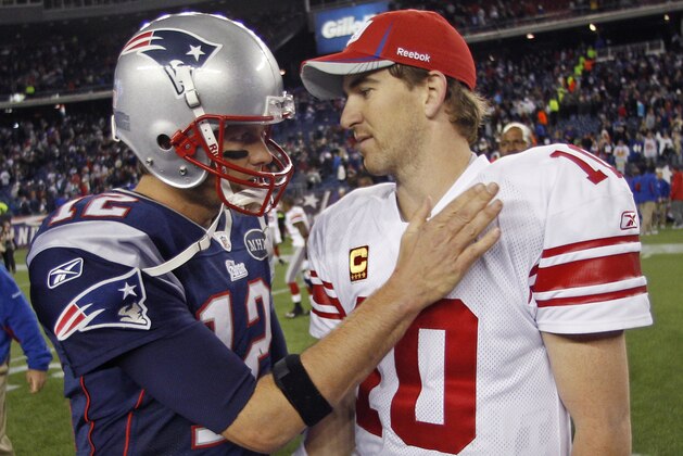ADVANCE FOR WEEKEND EDITIONS, JAN. 28-29 -FILE - In this Nov. 6, 2011, file photo, New York Giants' Eli Manning, right, is congratulated by New England Patriots' Tom Brady after the Giants' 24-20 win in an NFL football game in Foxborough, Mass. The Patriots face the Giants in Super Bowl XLVI on Sunday, Feb. 5, 2012, in Indianapolis. (AP Photo/Charles Krupa, File)