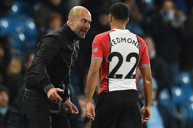 Manchester City's Spanish manager Pep Guardiola reacts as he talks with Southampton's English midfielder Nathan Redmond following the English Premier League football match between Manchester City and Southampton at the Etihad Stadium in Manchester, north west England, on November 29, 2017.
Manchester City won the match 2-1. / AFP PHOTO / Oli SCARFF / RESTRICTED TO EDITORIAL USE. No use with unauthorized audio, video, data, fixture lists, club/league logos or 'live' services. Online in-match use limited to 75 images, no video emulation. No use in betting, games or single club/league/player publications.  /         (Photo credit should read OLI SCARFF/AFP/Getty Images)