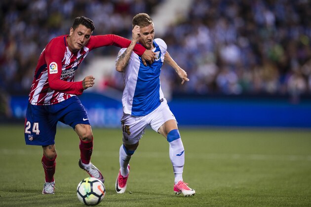 MADRID, SPAIN - SEPTEMBER 30: Raul Garcia Carnero of CD Leganes (R) fights for the ball with Jose Maria Gimenez de Vargas of Atletico de Madrid (L) during the La Liga 2017-18 match between CD Leganes and Atletico de Madrid on 30 September 2017 in Madrid, Spain. (Photo by Power Sport Images/Getty Images)