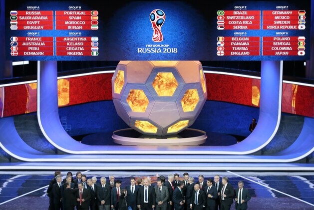 The coaches of the qualified teams pose for a group photo at the end of the 2018 soccer World Cup draw in the Kremlin in Moscow, Friday, Dec. 1, 2017. (AP Photo/Ivan Sekretarev)