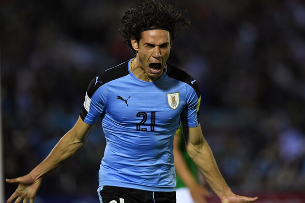 TOPSHOT - Uruguay's Edinson Cavani celebrates after scoring against Bolivia during their 2018 World Cup football qualifier match in Montevideo, on October 10, 2017. / AFP PHOTO / PABLO PORCIUNCULA        (Photo credit should read PABLO PORCIUNCULA/AFP/Getty Images)