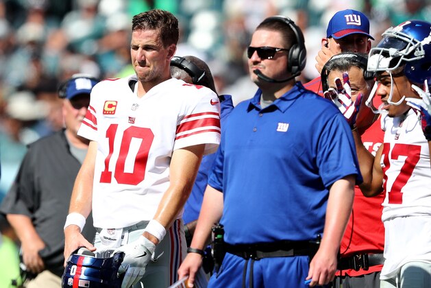 PHILADELPHIA, PA - SEPTEMBER 24:  Eli Manning #10 of the New York Giants and head coach Ben McAdoo wait for the review on a touchdown scored in the second quarter by the New York Giants  on September 24, 2017  at Lincoln Financial Field in Philadelphia, Pennsylvania.The touchdown was called back and the New York Giants did not score on the possession against the Philadelphia Eagles.  (Photo by Elsa/Getty Images)