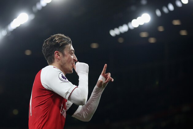 LONDON, ENGLAND - NOVEMBER 29:  Mesut Ozil of Arsenal celebrates scoring a goal during the Premier League match between Arsenal and Huddersfield Town at Emirates Stadium on November 29, 2017 in London, England.  (Photo by Julian Finney/Getty Images)