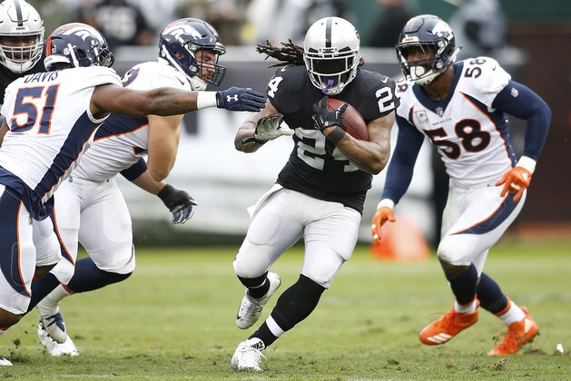 Oakland Raiders running back Marshawn Lynch (24) runs against the Denver Broncos during an NFL football game in Oakland, Calif., Sunday, Nov. 26, 2017. (AP Photo/D. Ross Cameron)