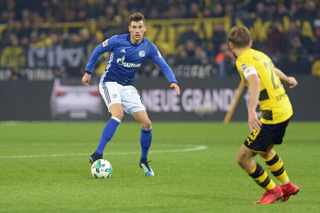 DORTMUND, GERMANY - NOVEMBER 25: Leon Goretzka of Schalke and Marcel Schmelzer of Dortmund battle for the ball during the Bundesliga match between Borussia Dortmund and FC Schalke 04 at Signal Iduna Park on November 25, 2017 in Dortmund, Germany. (Photo by TF-Images/TF-Images via Getty Images)