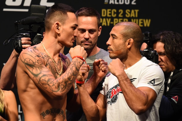 DETROIT, MI - DECEMBER 01:  (L-R) Max Holloway and Jose Aldo of Brazil face off during the UFC 218 weigh-in inside Little Caesars Arena on December 1, 2017 in Detroit, Michigan. (Photo by Josh Hedges/Zuffa LLC/Zuffa LLC via Getty Images)