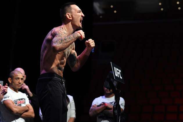 DETROIT, MI - DECEMBER 01:  Max Holloway poses on the scale during the UFC 218 weigh-in inside Little Caesars Arena on December 1, 2017 in Detroit, Michigan. (Photo by Mike Roach/Zuffa LLC/Zuffa LLC via Getty Images)