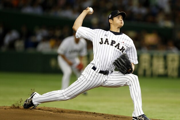 FILE - In this Nov. 19, 2015, file photo, Japan's starter Shohei Otani pitches against South Korea during the first inning of their semifinal game at the Premier12 world baseball tournament at Tokyo Dome in Tokyo. A person familiar with the decision says Major League Baseball owners on Friday, Dec. 1, 2017, have approved a new posting agreement with their Japanese counterparts in a move that allows bidding to start for coveted pitcher and outfielder Shohei Ohtani.   The person spoke on condition of anonymity because no announcement had been made.  (AP Photo/Toru Takahashi, File)