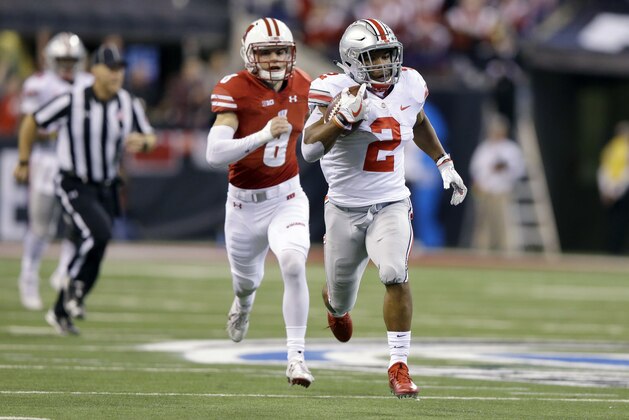 Ohio State running back J.K. Dobbins runs with the ball as Wisconsin safety Joe Ferguson gives chase during the first half of the Big Ten championship NCAA college football game, Saturday, Dec. 2, 2017, in Indianapolis. (AP Photo/Michael Conroy)