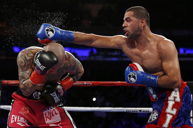 Sadam Ali, right, punches Miguel Cotto during the fifth round of a WBO junior middleweight title boxing match Saturday, Dec. 2, 2017, in New York. (AP Photo/Adam Hunger)