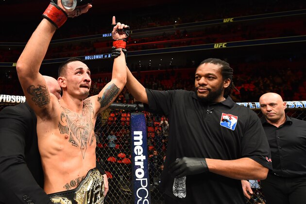 DETROIT, MI - DECEMBER 02:  UFC featherweight champion Max Holloway celebrates after defeating Jose Aldo of Brazil in their UFC featherweight championship bout during the UFC 218 event inside Little Caesars Arena on December 02, 2017 in Detroit, Michigan. (Photo by Josh Hedges/Zuffa LLC/Zuffa LLC via Getty Images)