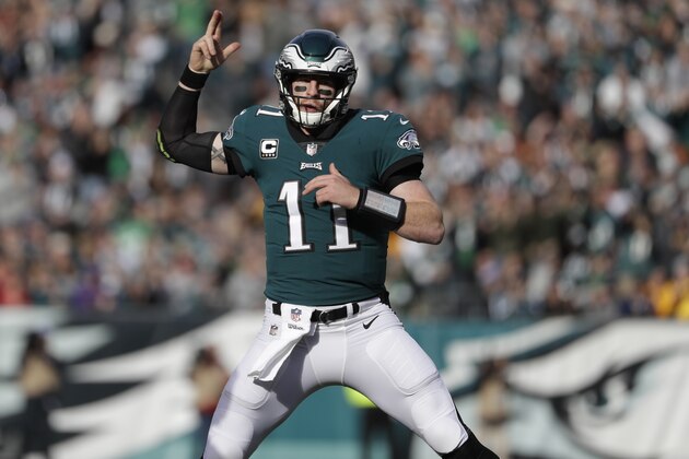 Philadelphia Eagles' Carson Wentz reacts after running for first down during the first half of an NFL football game against the Chicago Bears, Sunday, Nov. 26, 2017, in Philadelphia. (AP Photo/Michael Perez)
