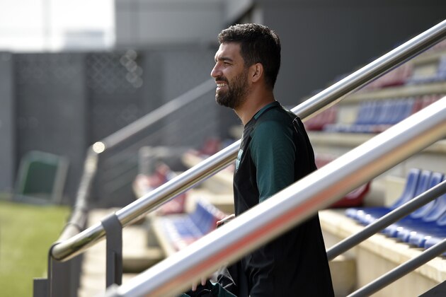 Barcelona's Turkish forward Arda Turan arrives for a training session at the Joan Gamper Sports Center in Sant Joan Despi, near Barcelona, on April 18, 2017 on the eve of the UEFA Champions League quarter-final second leg football match FC Barcelona vs Juventus. / AFP PHOTO / LLUIS GENE        (Photo credit should read LLUIS GENE/AFP/Getty Images)