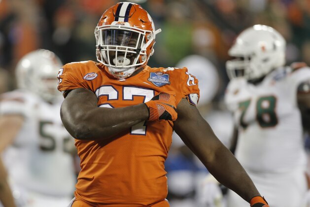 Clemson's Albert Huggins (67) celebrates after a sack against Miami during the second half of the Atlantic Coast Conference championship NCAA college football game in Charlotte, N.C., Saturday, Dec. 2, 2017. (AP Photo/Bob Leverone)