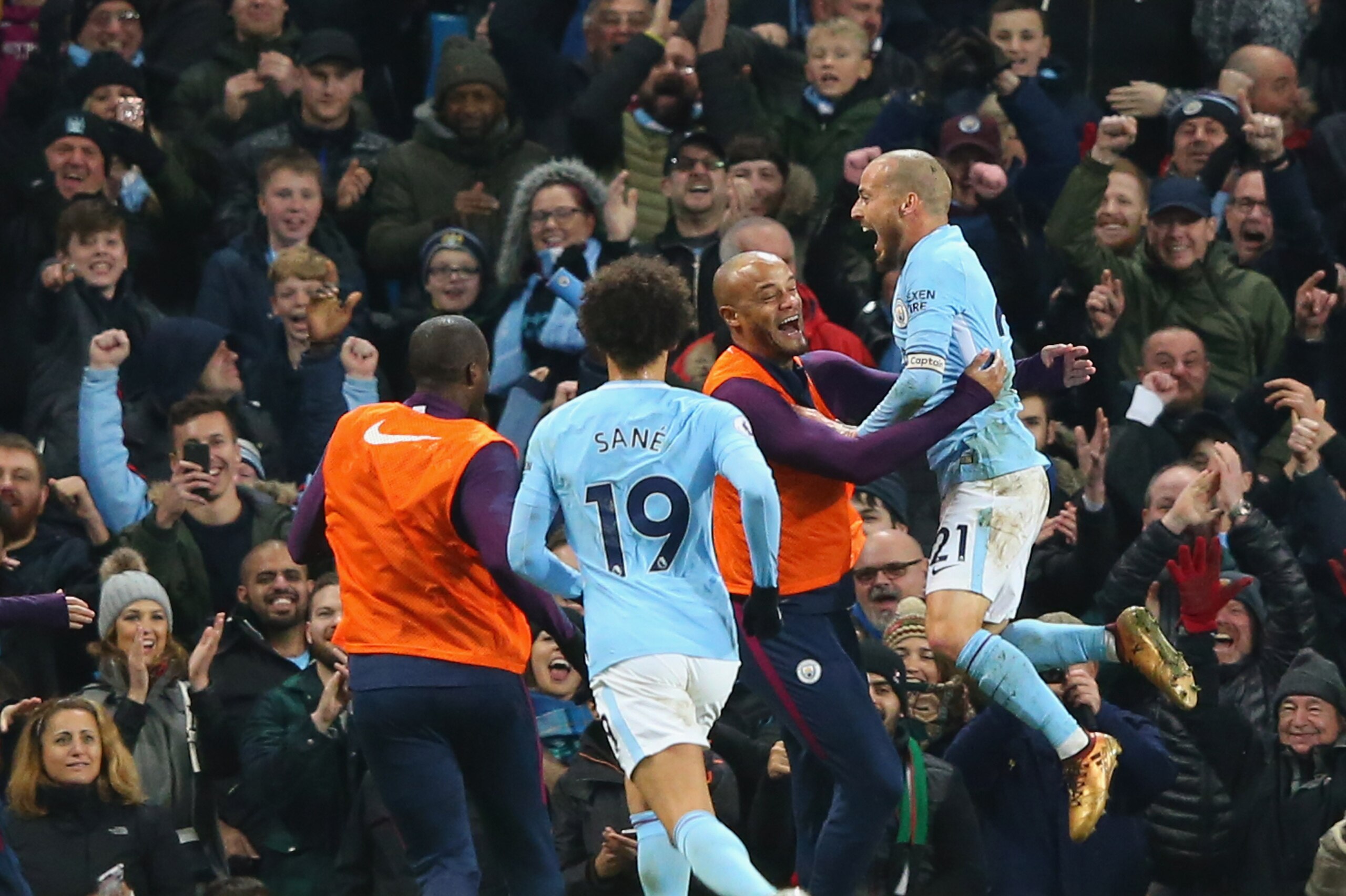 MANCHESTER, ENGLAND - DECEMBER 03:  David Silva of Manchester City celebrates with Vincent Kompany after scoring the winning goal during the Premier League match between Manchester City and West Ham United at Etihad Stadium on December 3, 2017 in Manchester, England.  (Photo by Alex Livesey - Danehouse/Getty Images)
