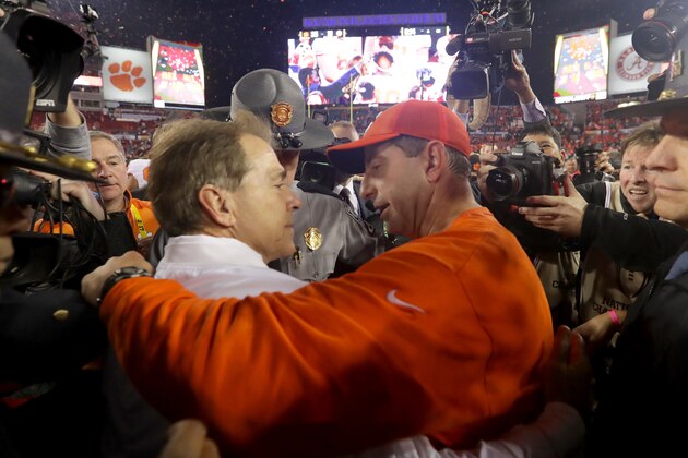TAMPA, FL - JANUARY 09:  Head coach Nick Saban of the Alabama Crimson Tide talks with head coach Dabo Swinney of the Clemson Tigers after the Tigers defeated the Crimson Tide 35-31 in the 2017 College Football Playoff National Championship Game at Raymond James Stadium on January 9, 2017 in Tampa, Florida.  (Photo by Streeter Lecka/Getty Images)