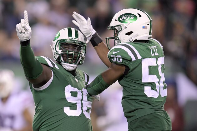 New York Jets defensive end Muhammad Wilkerson (96) and inside linebacker Darron Lee (58) celebrate after a play against the Buffalo Bills during the second half of an NFL football game, Thursday, Nov. 2, 2017, in East Rutherford, N.J. (AP Photo/Bill Kostroun)