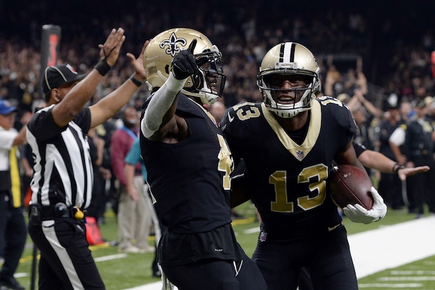 New Orleans Saints wide receiver Michael Thomas (13) celebrates his touchdown reception with running back Alvin Kamara in the first half of an NFL football game against the Carolina Panthers in New Orleans, Sunday, Dec. 3, 2017. (AP Photo/Bill Feig)