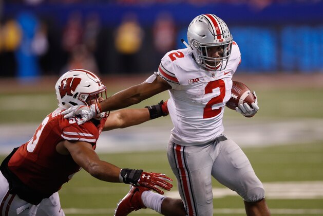 INDIANAPOLIS, IN - DECEMBER 02: Running back J.K. Dobbins #2 of the Ohio State Buckeyes runs the ball against linebacker T.J. Edwards #53 of the Wisconsin Badgers in the fourth quarter during the Big Ten Championship game at Lucas Oil Stadium on December 2, 2017 in Indianapolis, Indiana.  (Photo by Joe Robbins/Getty Images)