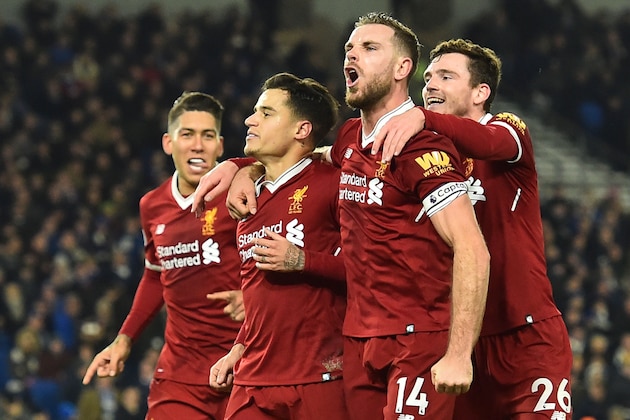 Liverpool's English midfielder Jordan Henderson (2R), Liverpool's Scottish defender Andrew Robertson (R) and Liverpool's Brazilian midfielder Roberto Firmino (L) celebrate after Liverpool's Brazilian midfielder Philippe Coutinho (2L) scored their fourth goal during the English Premier League football match between Brighton and Hove Albion and Liverpool at the American Express Community Stadium in Brighton, southern England on December 2, 2017. / AFP PHOTO / Glyn KIRK / RESTRICTED TO EDITORIAL USE. No use with unauthorized audio, video, data, fixture lists, club/league logos or 'live' services. Online in-match use limited to 75 images, no video emulation. No use in betting, games or single club/league/player publications.  /         (Photo credit should read GLYN KIRK/AFP/Getty Images)