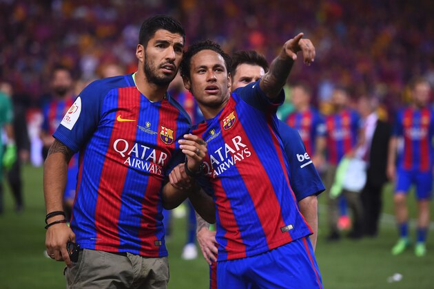 Barcelona's Brazilian forward Neymar (R) gestures past Barcelona's Uruguayan forward Luis Suarez at the end of the Spanish Copa del Rey (King's Cup) final football match FC Barcelona vs Deportivo Alaves at the Vicente Calderon stadium in Madrid on May 27, 2017.
Barcelona won 3-1. / AFP PHOTO / Josep LAGO        (Photo credit should read JOSEP LAGO/AFP/Getty Images)