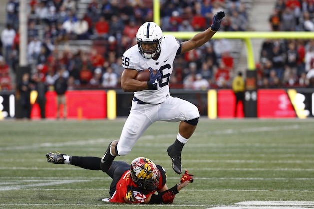 Penn State running back Saquon Barkley, top, rushes past Maryland linebacker Shane Cockerille in the first half of an NCAA college football game in College Park, Md., Saturday, Nov. 25, 2017. (AP Photo/Patrick Semansky)