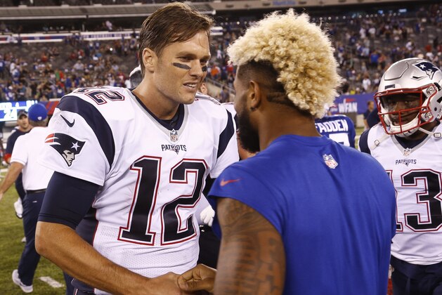 EAST RUTHERFORD, NJ - SEPTEMBER 01: Tom Brady #12 of the New England Patriots talks with Odell Beckham #13 of the New York Giants during a preseason game at MetLife Stadium on September 1, 2016 in East Rutherford, New Jersey. (Photo by Jeff Zelevansky/Getty Images)