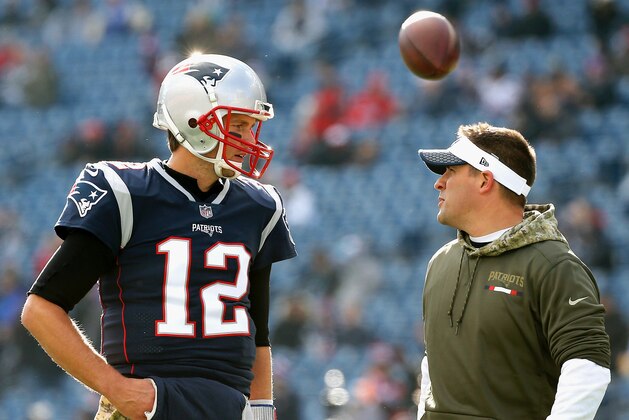 FOXBORO, MA - NOVEMBER 26:  Tom Brady #12  of the New England Patriots reacts with offensive coordinator Josh McDaniels before a game against the Miami Dolphins at Gillette Stadium on November 26, 2017 in Foxboro, Massachusetts.  (Photo by Jim Rogash/Getty Images)