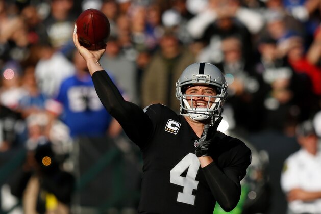 OAKLAND, CA - DECEMBER 03:  Derek Carr #4 of the Oakland Raiders looks to pass against the New York Giants during their NFL game at Oakland-Alameda County Coliseum on December 3, 2017 in Oakland, California.  (Photo by Lachlan Cunningham/Getty Images)