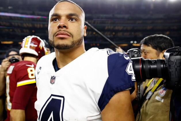 ARLINGTON, TX - NOVEMBER 30:  Dak Prescott #4 of the Dallas Cowboys walks off the field after the 38-14 win over the Washington Redskins at AT&T Stadium on November 30, 2017 in Arlington, Texas.  (Photo by Wesley Hitt/Getty Images)