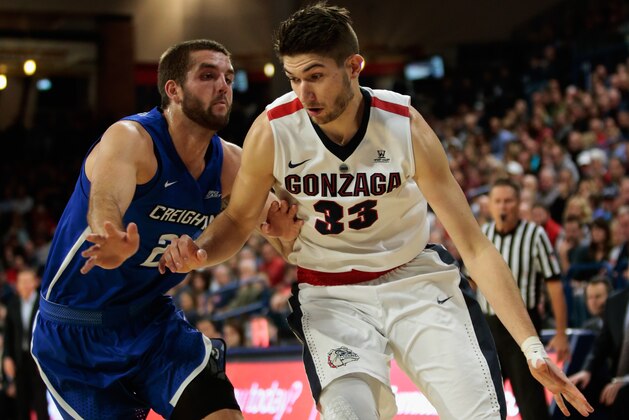 SPOKANE, WA - DECEMBER 01:  Killian Tillie #33 of the Gonzaga Bulldogs drives against Mitch Ballock #24 of the Creighton Bluejays in the first half at McCarthey Athletic Center on December 1, 2017 in Spokane, Washington.  (Photo by William Mancebo/Getty Images)