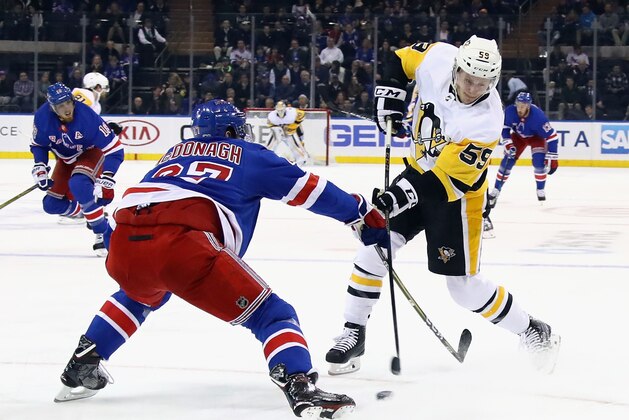 NEW YORK, NY - OCTOBER 17: Ryan McDonagh #27 of the New York Rangers attempts to block a shot by Jake Guentzel #59 of the Pittsburgh Penguins during the first period at Madison Square Garden on October 17, 2017 in New York City.  (Photo by Bruce Bennett/Getty Images)