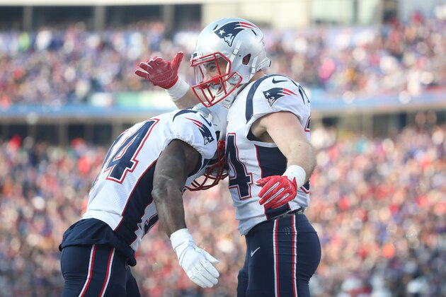 BUFFALO, NY - DECEMBER 3: Rex Burkhead #34 of the New England Patriots is congratulated by Brandin Cooks #14 after scoring a touchdown during NFL game action against the Buffalo Bills at New Era Field on December 3, 2017 in Buffalo, New York. (Photo by Tom Szczerbowski/Getty Images)