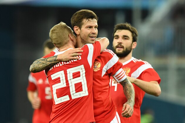 Russia's Fedor Smolov (C) celebrates after scoring the team's third goal during an international friendly football match between Russia and Spain at the Saint Petersburg Stadium in Saint Petersburg on November 14, 2017. / AFP PHOTO / Kirill KUDRYAVTSEV        (Photo credit should read KIRILL KUDRYAVTSEV/AFP/Getty Images)