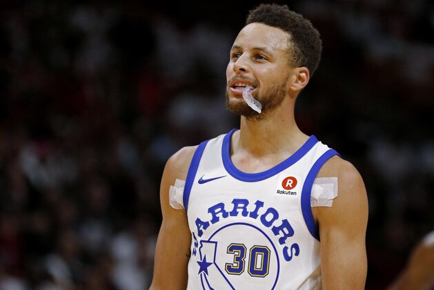 Golden State Warriors guard Stephen Curry looks downcourt during a timeout as the Warriors played the Miami Heat in an NBA basketball game Sunday, Dec. 3, 2017, in Miami. The Warriors won 123-95. (AP Photo/Joe Skipper)