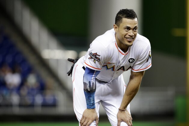 Miami Marlins' Giancarlo Stanton stands on the field during a baseball game against the San Francisco Giants, Monday, Aug. 14, 2017, in Miami. (AP Photo/Lynne Sladky)