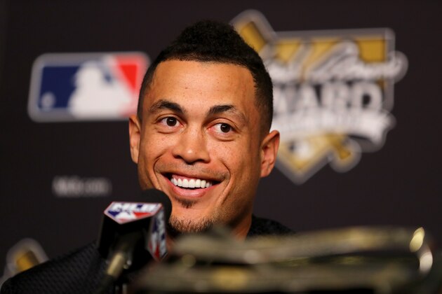 LOS ANGELES, CA - OCTOBER 25:  2017 Hank Aaron Award recipient Giancarlo Stanton #27 of the Miami Marlins attends the 2017 Hank Aaron Award press conference prior to game two of the 2017 World Series between the Houston Astros and the Los Angeles Dodgers at Dodger Stadium on October 25, 2017 in Los Angeles, California.  (Photo by Tim Bradbury/Getty Images)