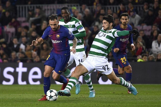 BARCELONA, SPAIN - DECEMBER 05: Paco Alcacer of Barcelona is challenged by Cristiano Piccini of Sporting Lisbon during the UEFA Champions League group D match between FC Barcelona and Sporting CP at Camp Nou on December 5, 2017 in Barcelona, Spain.  (Photo by Alex Caparros/Getty Images)