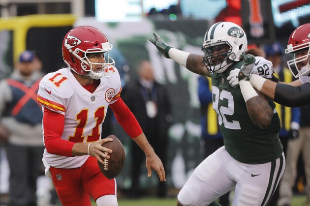 Kansas City Chiefs quarterback Alex Smith, left, looks to throw during the first half of an NFL football game against the New York Jets, Sunday, Dec. 3, 2017, in East Rutherford, N.J. (AP Photo/Julie Jacobson)