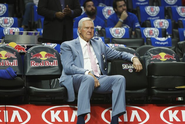 Jerry West sits on the bench before an NBA basketball game between the Los Angeles Clippers and the Phoenix Suns Saturday, Oct. 21, 2017, in Los Angeles. (AP Photo/Jae C. Hong)