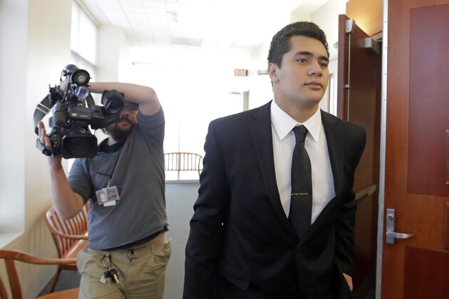 FILE - In this Oct. 14, 2016, file photo, Osa Masina, a suspended University of Southern California football player charged with rape in Utah, leaves the courtroom in Salt Lake City. Masina accused of sexual assault in Utah pleaded guilty Thursday, Oct. 12, 2017, to misdemeanor charges in a deal with prosecutors. The agreement carries no possible state prison time for 20-year-old Osa Masina, but he could be sentenced to three years in county jail and probation. (AP Photo/Rick Bowmer, File)