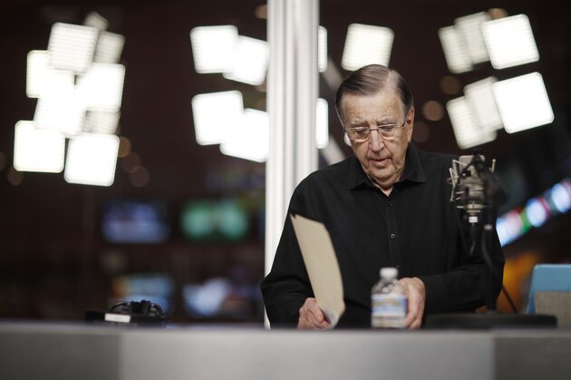 In this Nov. 16, 2017, photo, Brent Musburger looks at notes during a broadcast at the South Point hotel and casino in Las Vegas. During the show, part of the Vegas Stats & Information Network, Musburger and others talk about sports betting. (AP Photo/John Locher)