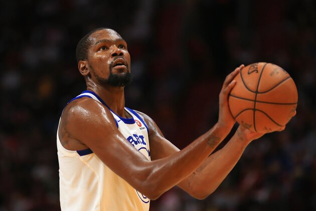 MIAMI, FL - DECEMBER 03: Kevin Durant #35 of the Golden State Warriors shoots a free throw during a game agaisnt the Miami Heat at American Airlines Arena on December 3, 2017 in Miami, Florida. NOTE TO USER: User expressly acknowledges and agrees that, by downloading and or using this photograph, User is consenting to the terms and conditions of the Getty Images License Agreement.  (Photo by Christopher Trotman/Getty Images)