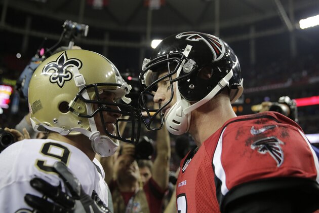 Atlanta Falcons quarterback Matt Ryan (2) speaks with New Orleans Saints quarterback Drew Brees (9) after an NFL football game, Sunday, Jan. 1, 2017, in Atlanta. The Atlanta Falcons won 38-32. (AP Photo/David Goldman)