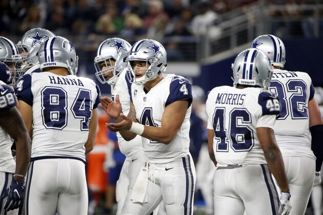 Dallas Cowboys quarterback Dak Prescott (4) breaks the huddle in the second half of an NFL football game against the Washington Redskins on Thursday, Nov. 30, 2017, in Arlington, Texas. (AP Photo/Michael Ainsworth)