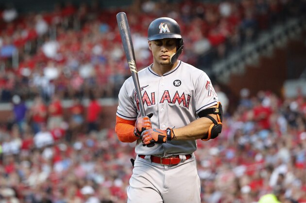 Miami Marlins' Giancarlo Stanton heads back to the dugout after striking out during the fifth inning of a baseball game against the St. Louis Cardinals Monday, July 3, 2017, in St. Louis. (AP Photo/Jeff Roberson)
