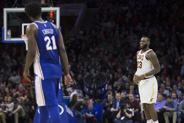 PHILADELPHIA, PA - NOVEMBER 27: LeBron James #23 of the Cleveland Cavaliers stares down Joel Embiid #21 of the Philadelphia 76ers after making a basket in front of him in the fourth quarter at the Wells Fargo Center on November 27, 2017 in Philadelphia, Pennsylvania. The Cavaliers defeated the 76ers 113-91. NOTE TO USER: User expressly acknowledges and agrees that, by downloading and or using this photograph, User is consenting to the terms and conditions of the Getty Images License Agreement. (Photo by Mitchell Leff/Getty Images)