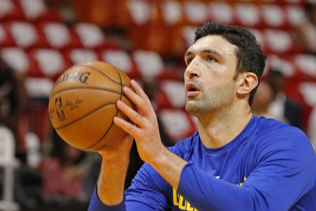 Golden State Warriors center Zaza Pachulia (27) shoots during warmups before the Warriors played against the Miami Heat in an NBA basketball game, Sunday, Dec. 3, 2017, in Miami. (AP Photo/Joe Skipper)